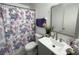 Cozy bathroom features a floral shower curtain and gray vanity with a square sink at 1866 Caralee Blvd # 3, Orlando, FL 32822