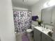 Bathroom with a new vanity and a floral shower curtain at 1866 Caralee Blvd # 3, Orlando, FL 32822