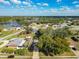 Scenic neighborhood view, featuring charming homes and mature trees near a tranquil lake at 2031 Roseway Ave, Deltona, FL 32738