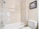 Classic bathroom with a tiled shower/tub combination and toilet, providing a clean and functional space at 2031 Roseway Ave, Deltona, FL 32738