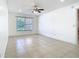 Bright bedroom with large windows and ceiling fan, creating a welcoming space at 2031 Roseway Ave, Deltona, FL 32738