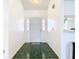 Bright entryway showcases tiled floors and a white front door with sidelights for natural lighting at 2031 Roseway Ave, Deltona, FL 32738