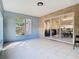 Bright sun room with tile floors, large windows overlooking the yard, and sliding glass doors to the interior at 2031 Roseway Ave, Deltona, FL 32738