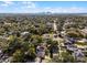 Aerial view of a neighborhood with lush greenery, single-Gathering homes and city skyline in the distance at 3211 Harrison, Orlando, FL 32804