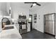 Kitchen features stainless steel appliances, subway tile backsplash, black hardware, and a door to the exterior at 3211 Harrison, Orlando, FL 32804