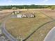 Wide angle aerial view of the property with a long driveway and outbuildings at 36525 Reserve Dr, Eustis, FL 32736