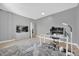 This bedroom features a stylish grey color scheme, a work-from-home setup, and hardwood floors at 36525 Reserve Dr, Eustis, FL 32736