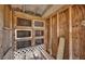 Inside the chicken coop are wire mesh cages, wood walls, and lattice underneath at 36525 Reserve Dr, Eustis, FL 32736