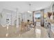 Bright dining room with modern chandelier, seating for four, and a large window at 36525 Reserve Dr, Eustis, FL 32736