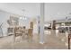 Inviting dining space with a glass table, modern chandelier, and seamless flow into the adjacent living area at 36525 Reserve Dr, Eustis, FL 32736