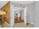 Open doorway looking into the living room, featuring hardwood floors and comfortable furniture at 36525 Reserve Dr, Eustis, FL 32736
