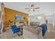 Comfortable living room with an accent wall, modern lighting, and stylish decor at 36525 Reserve Dr, Eustis, FL 32736