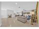 Expansive living room showcases an open floor plan, tile flooring, and access to outdoor space at 36525 Reserve Dr, Eustis, FL 32736