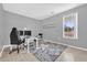 Minimalist office space with a large window, modern desk, and neutral color scheme at 36525 Reserve Dr, Eustis, FL 32736