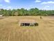 Aerial view of an outbuilding for equipment storage on a large grassy lot at 36525 Reserve Dr, Eustis, FL 32736