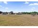 Sprawling property featuring outbuildings, barns, and a beautiful manicured lawn at 36525 Reserve Dr, Eustis, FL 32736