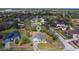 Overhead view of a neighborhood showcasing a single-Gathering home with a well-kept lawn at 3978 Old Dunn Rd, Apopka, FL 32712