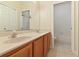 Bathroom with a double sink vanity and walk-in shower at 3978 Old Dunn Rd, Apopka, FL 32712