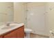 Bathroom with a walk-in shower and wood vanity at 3978 Old Dunn Rd, Apopka, FL 32712