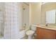 Bathroom with a bathtub and shower combination, vanity with storage, toilet and a mirror at 3978 Old Dunn Rd, Apopka, FL 32712