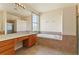 This bright primary bathroom features a tub, shower, vanity, and window at 3978 Old Dunn Rd, Apopka, FL 32712
