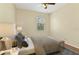 Bright bedroom featuring a large window, ceiling fan, and a neutral color scheme at 3978 Old Dunn Rd, Apopka, FL 32712