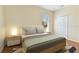 Bright bedroom with neutral walls, wooden floors, ceiling fan, and closet with a window at 3978 Old Dunn Rd, Apopka, FL 32712