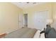 Bright bedroom features a large window, ample closet space and stylish decor at 3978 Old Dunn Rd, Apopka, FL 32712