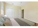 Bedroom featuring neutral walls, wooden floors, closet, and an open door to a bath at 3978 Old Dunn Rd, Apopka, FL 32712