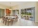 Open dining area with seating for six and sliding glass doors to the screened lanai at 3978 Old Dunn Rd, Apopka, FL 32712