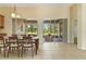 Bright dining area with elegant table and chairs, and screened patio with sliding doors at 3978 Old Dunn Rd, Apopka, FL 32712