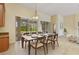 Dining area with a view of the lanai and backyard at 3978 Old Dunn Rd, Apopka, FL 32712