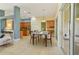 Dining area adjacent to kitchen featuring tile floors and sliding glass doors with lots of light at 3978 Old Dunn Rd, Apopka, FL 32712