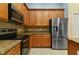 Well-appointed kitchen with stainless steel appliances, granite counters, and ample storage at 3978 Old Dunn Rd, Apopka, FL 32712