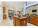 Bright kitchen featuring a center island, stainless appliances and an adjacent dining area at 3978 Old Dunn Rd, Apopka, FL 32712