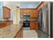 Well-equipped kitchen with stainless steel appliances and granite counters at 3978 Old Dunn Rd, Apopka, FL 32712