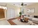Living room with neutral walls, wooden floors, and a decorative rug at 3978 Old Dunn Rd, Apopka, FL 32712