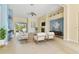 Bright living room with tile flooring, fireplace, and sliding glass doors to the outdoor patio at 3978 Old Dunn Rd, Apopka, FL 32712