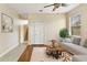 Bright living room features neutral tones, hardwood floors, and natural light from the window at 3978 Old Dunn Rd, Apopka, FL 32712