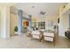 Spacious open-concept living room with neutral tones, tile floors, and stylish furnishings at 3978 Old Dunn Rd, Apopka, FL 32712