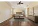 Spacious main bedroom featuring a ceiling fan, wood floors, and tray ceiling at 3978 Old Dunn Rd, Apopka, FL 32712