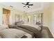 This primary bedroom has tray ceilings, wood floors and access to lanai at 3978 Old Dunn Rd, Apopka, FL 32712