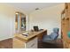 Bright office features a modern desk, comfortable chair, and stylish shelving, perfect for a productive workspace at 3978 Old Dunn Rd, Apopka, FL 32712