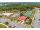 Overhead view of well-maintained volleyball, tennis, and basketball courts, and nearby parking for residents at 3978 Old Dunn Rd, Apopka, FL 32712