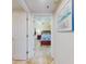 Comfortable bedroom with a queen bed and tiled floors at 5300 S Atlantic Ave # 6-206, New Smyrna Beach, FL 32169