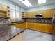 Community kitchen with ample counter space, stainless appliances, and modern cabinetry at 5300 S Atlantic Ave # 6-206, New Smyrna Beach, FL 32169