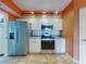 Bright kitchen with stainless steel appliances and ample counter space for food preparation at 5300 S Atlantic Ave # 6-206, New Smyrna Beach, FL 32169