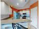 Modern kitchen featuring white cabinets, stainless steel appliances, and a breakfast bar with seating at 5300 S Atlantic Ave # 6-206, New Smyrna Beach, FL 32169