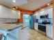 Well-lit kitchen features granite countertops, stainless steel appliances, and a convenient breakfast bar at 5300 S Atlantic Ave # 6-206, New Smyrna Beach, FL 32169