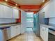 Modern kitchen features stainless steel appliances and access to in-unit laundry room for convenience at 5300 S Atlantic Ave # 6-206, New Smyrna Beach, FL 32169